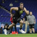 North Carolina offensive lineman Charlie Heck runs a drill at the NFL football scouting combine in Indianapolis, Friday, Feb. 28, 2020. (AP Photo/Michael Conroy)