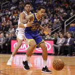 Golden State Warriors forward Juan Toscano-Anderson (95) loses the ball as Phoenix Suns guard Devin Booker defends during the first half of an NBA basketball game, Wednesday, Feb. 12, 2020, in Phoenix. (AP Photo/Matt York)
