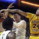 California forward Grant Anticevich, center, is defended by Arizona State forward Jalen Graham (24) during the first half of an NCAA college basketball game in Berkeley, Calif., Sunday, Feb. 16, 2020. (AP Photo/Jeff Chiu)