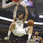 Milwaukee Bucks' Brook Lopez (11) dunks in front of the Phoenix Suns during the first half of an NBA basketball game Sunday, Feb. 2, 2020, in Milwaukee. (AP Photo/Jeffrey Phelps)