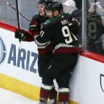 Arizona Coyotes right wing Clayton Keller, left, celebrates his goal against the Buffalo Sabres with left wing Taylor Hall (91) during the third period of an NHL hockey game Saturday, Feb. 29, 2020, in Glendale, Ariz. The Coyotes won 5-2. (AP Photo/Ross D. Franklin)