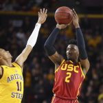 Southern California guard Jonah Mathews (2) shoots over Arizona State guard Alonzo Verge Jr. (11) during the first half of an NCAA college basketball game Saturday, Feb. 8, 2020, in Tempe, Ariz. (AP Photo/Ross D. Franklin)