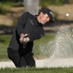 Phil Mickelson hits out of a bunker onto the second green of the Pebble Beach Golf Links during the final round of the AT&T Pebble Beach National Pro-Am golf tournament Sunday, Feb. 9, 2020, in Pebble Beach, Calif. (AP Photo/Eric Risberg)