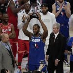 Kawhi Leonard of the Los Angeles Clippers holds up his NBA All-Star Game Kobe Bryant MVP Award after the NBA All-Star basketball game Sunday, Feb. 16, 2020, in Chicago. (AP Photo/David Banks)