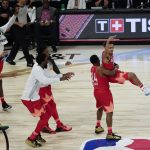 Trae Young of the Atlanta Hawks celebrates after makingf a three-point basket during the first half of the NBA All-Star basketball game Sunday, Feb. 16, 2020, in Chicago. (AP Photo/David Banks)