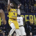 Arizona State forward Kimani Lawrence (4) shoots in front of California forward Kuany Kuany (12) during the first half of an NCAA college basketball game in Berkeley, Calif., Sunday, Feb. 16, 2020. (AP Photo/Jeff Chiu)