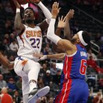 Phoenix Suns center Deandre Ayton (22) shoots over Detroit Pistons guard Bruce Brown (6) during the first half of an NBA basketball game, Wednesday, Feb. 5, 2020, in Detroit. (AP Photo/Carlos Osorio)