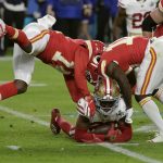 San Francisco 49ers' Tarvarius Moore, on the turf, clutches the ball after his interception against the Kansas City Chiefs during the second half of the NFL Super Bowl 54 football game Sunday, Feb. 2, 2020, in Miami Gardens, Fla. (AP Photo/Matt York)