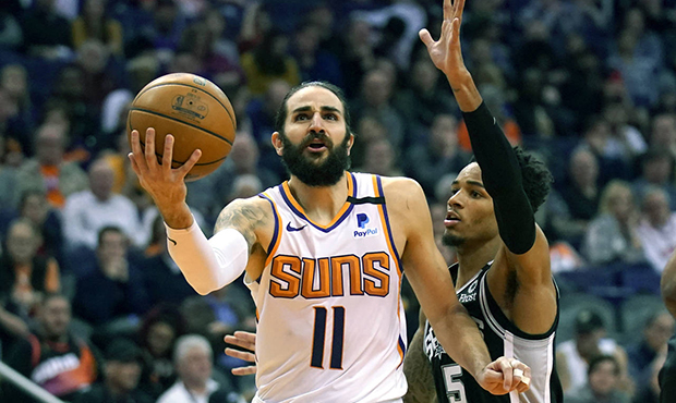 Phoenix Suns guard Ricky Rubio (11) drives by San Antonio Spurs guard Dejounte Murray during the se...