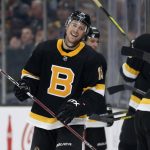 Boston Bruins' Charlie Coyle smiles after scoring his second goal of the game during the third period of an NHL hockey game against the Arizona Coyotes Saturday, Feb. 8, 2020, in Boston. (AP Photo/Winslow Townson)