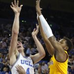 UCLA guard Jaime Jaquez Jr. (4) shoots under pressure from Arizona State forward Kimani Lawrence (4) during the first half of an NCAA college basketball game Thursday, Feb. 27, 2020, in Los Angeles. (AP Photo/Ringo H.W. Chiu)