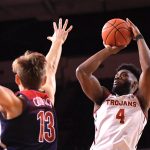Southern California guard Daniel Utomi, right, shoots as Arizona forward Stone Gettings defends during the first half of an NCAA college basketball game Thursday, Feb. 27, 2020, in Los Angeles. (AP Photo/Mark J. Terrill)