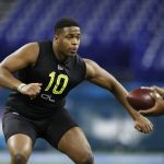 Charlotte offensive lineman Cameron Clark runs a drill at the NFL football scouting combine in Indianapolis, Friday, Feb. 28, 2020. (AP Photo/Charlie Neibergall)