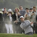 Aaron Rodgers hits out of a bunker onto the sixth green of the Pebble Beach Golf Links during the third round of the AT&T Pebble Beach National Pro-Am golf tournament Saturday, Feb. 8, 2020, in Pebble Beach, Calif. (AP Photo/Eric Risberg)
