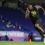 Mississippi State offensive lineman Tyre Phillips runs a drill at the NFL football scouting combine in Indianapolis, Friday, Feb. 28, 2020. (AP Photo/Michael Conroy)