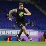 Oregon offensive lineman Calvin Throckmorton runs a drill at the NFL football scouting combine in Indianapolis, Friday, Feb. 28, 2020. (AP Photo/Michael Conroy)