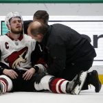 Arizona Coyotes defenseman Oliver Ekman-Larsson (23) is examined by trainers after a hit by Dallas Stars left wing Jamie Benn that resulted in a penalty against Benn, during the second period of an NHL hockey game in Dallas, Wednesday, Feb. 19, 2019. (AP Photo/Michael Ainsworth)