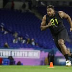 Wake Forest offensive lineman Justin Herron runs a drill at the NFL football scouting combine in Indianapolis, Friday, Feb. 28, 2020. (AP Photo/Michael Conroy)