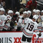 Chicago Blackhawks center Jonathan Toews (19) celebrates his goal against the Arizona Coyotes during a shootout in an NHL hockey game Saturday, Feb. 1, 2020, in Glendale, Ariz. (AP Photo/Ross D. Franklin)