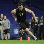 Boise State offensive lineman Ezra Cleveland runs a drill at the NFL football scouting combine in Indianapolis, Friday, Feb. 28, 2020. (AP Photo/Michael Conroy)