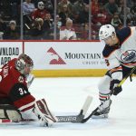 Arizona Coyotes goaltender Antti Raanta (32) makes a save as Edmonton Oilers right wing Alex Chiasson (39) tries to get to the puck during the second period of an NHL hockey game Tuesday, Feb. 4, 2020, in Glendale, Ariz. (AP Photo/Ross D. Franklin)