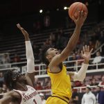 Arizona State guard Remy Martin, right, shoots next to Stanford guard Daejon Davis during the second half of an NCAA college basketball game in Stanford, Calif., Thursday, Feb. 13, 2020. (AP Photo/Jeff Chiu)