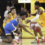 UCLA's Chris Smith (5) loses the ball next to Arizona State's Rob Edwards, left, and Romello White (23) during the second half of an NCAA college basketball game Thursday, Feb. 6, 2020, in Tempe, Ariz. (AP Photo/Darryl Webb)