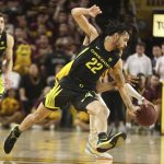Oregon's Addison Patterson (22) goes for a steal against Arizona State's Alonzo Verge (11) during the second half of an NCAA college basketball game Thursday, Feb. 20, 2020, in Tempe, Ariz.(AP Photo/Darryl Webb)