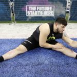 Missouri offensive lineman Trystan Colon-Castillo stretches at the NFL football scouting combine in Indianapolis, Friday, Feb. 28, 2020. (AP Photo/Charlie Neibergall)