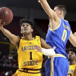 Arizona State's Remy Martin (1) goes to the basket past UCLA's Alex Olesinski (0) during the second half of an NCAA college basketball game Thursday, Feb. 6, 2020, in Tempe, Ariz. (AP Photo/Darryl Webb)