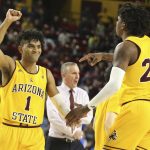 Arizona State's Remy Martin (1) and Romello White (23) celebrate during the first half of the team's NCAA college basketball game against UCLA on Thursday, Feb. 6, 2020, in Tempe, Ariz. (AP Photo/Darryl Webb)