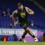 Oregon offensive lineman Shane Lemieux runs a drill at the NFL football scouting combine in Indianapolis, Friday, Feb. 28, 2020. (AP Photo/Michael Conroy)