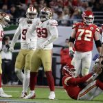 San Francisco 49ers' DeForest Buckner (99) celebrates after sacking Kansas City Chiefs quarterback Patrick Mahomes, bottom right, during the second half of the NFL Super Bowl 54 football game Sunday, Feb. 2, 2020, in Miami Gardens, Fla. (AP Photo/Wilfredo Lee)