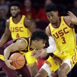 
              Arizona State guard Remy Martin, left, is defended by Southern California guard Elijah Weaver (3) during the first half of an NCAA college basketball game Saturday, Feb. 29, 2020, in Los Angeles. (AP Photo/Marcio Jose Sanchez)
            