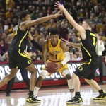 Arizona State's Remy Martin (1) gets double-teamed by Oregon's Chandler Lawson (13) and Payton Pritchard (3) during the second half of an NCAA college basketball game Thursday, Feb. 20, 2020, in Tempe, Ariz. (AP Photo/Darryl Webb)