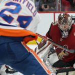 Arizona Coyotes goaltender Antti Raanta makes the save on a shot by New York Islanders defenseman Scott Mayfield (24) in the third period during an NHL hockey game, Monday, Feb. 17, 2020, in Glendale, Ariz. Coyotes won 2-1. (AP Photo/Rick Scuteri)