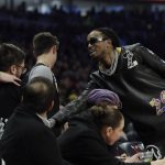 Quavo talks to fans during the second half of the NBA All-Star basketball game Sunday, Feb. 16, 2020, in Chicago. (AP Photo/Nam Huh)
