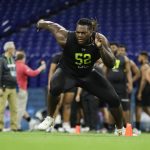 Georgia offensive lineman Isaiah Wilson runs a drill at the NFL football scouting combine in Indianapolis, Friday, Feb. 28, 2020. (AP Photo/Michael Conroy)