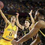 Arizona State's Alonzo Verge (11) takes the ball to the basket as Oregon's Chris Duarte (5) defends during the second half of an NCAA college basketball game Thursday, Feb. 20, 2020 in Tempe, Ariz. (AP Photo/Darryl Webb)