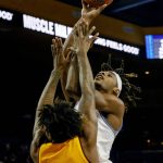 UCLA forward Jalen Hill, right, shoots over Arizona State forward Romello White during the first half of an NCAA college basketball game Thursday, Feb. 27, 2020, in Los Angeles. (AP Photo/Ringo H.W. Chiu)