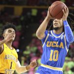 UCLA's Tyger Campbell (10) drives to the basket against Arizona State's Remy Martin (1) during the first half of an NCAA college basketball game Thursday, Feb. 6, 2020, in Tempe, Ariz. (AP Photo/Darryl Webb)