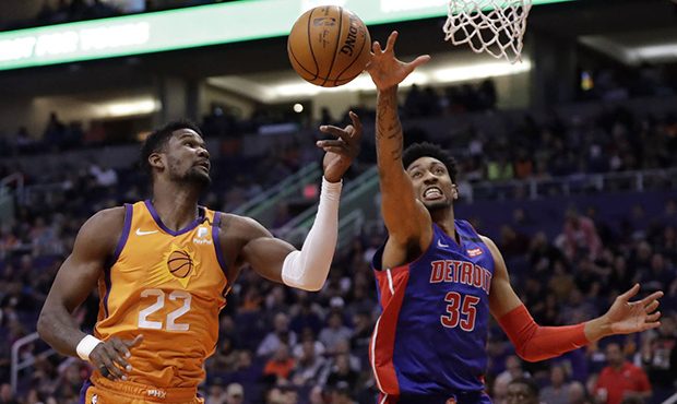 Phoenix Suns center Deandre Ayton (22) battles Detroit Pistons forward Christian Wood (35) for the ...