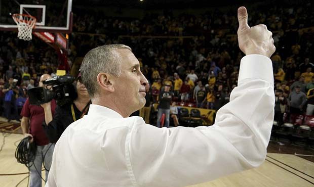 Arizona State head coach Bobby Hurley gives a thumbs up to the crowd after his team upset Oregon 77...