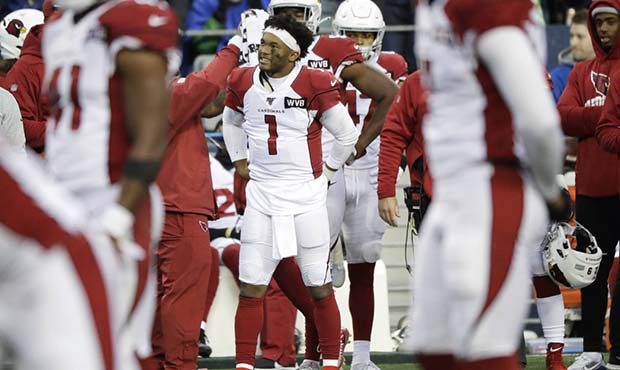 Arizona Cardinals starting quarterback Kyler Murray (1) stands on the sideline after leaving with a...