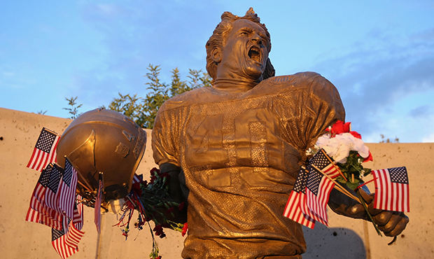 GLENDALE, AZ - SEPTEMBER 11:  Fans adorn the Pat Tillman statue with American flags in honor of the...