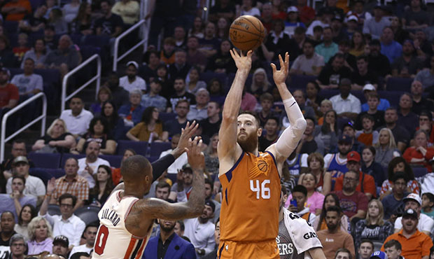 Phoenix Suns center Aron Baynes (46) shoots a 3-pointer over Portland Trail Blazers guard Damian Li...