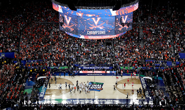 The Virginia Cavaliers celebrate their teams 85-77 win over the Texas Tech Red Raiders to win the t...