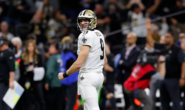 Drew Brees #9 of the New Orleans Saints reacts after a second quarter rushing touchdown by Alvin Ka...