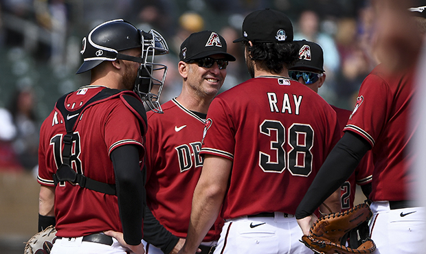 Manager Torey Lovullo #17 of the Arizona Diamondbacks relieves Robbie Ray #38 in the second inning ...