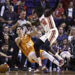 Phoenix Suns forward Dario Saric (20) is fouled by Portland Trail Blazers forward Wenyen Gabriel (35) during the first half of an NBA basketball game Friday, March 6, 2020, in Phoenix. (AP Photo/Ross D. Franklin)